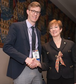 Dr. Monica Morrow presents Dr. Michael Lowe with the 2018 Young Investigator Award